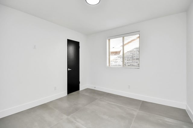 spare room featuring concrete floors