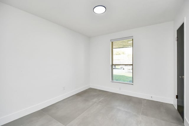 spare room with concrete flooring