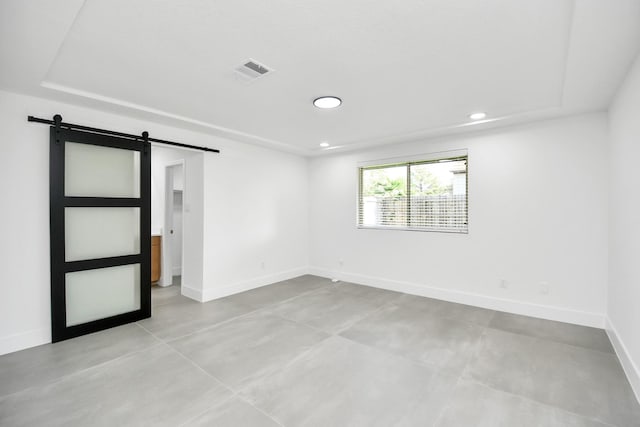 empty room featuring a barn door