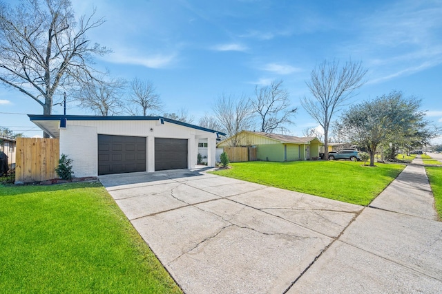 exterior space with a garage and a front yard