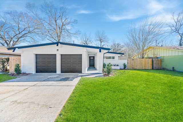 ranch-style home with a garage and a front yard