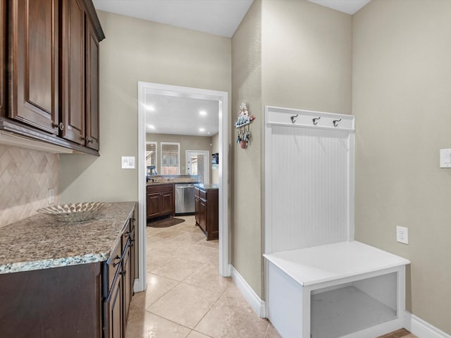 mudroom with light tile patterned flooring