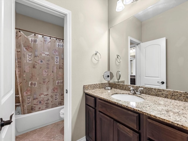 full bathroom with tile patterned flooring, vanity, toilet, and shower / bath combo with shower curtain