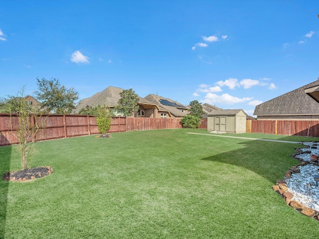 view of yard with a storage unit