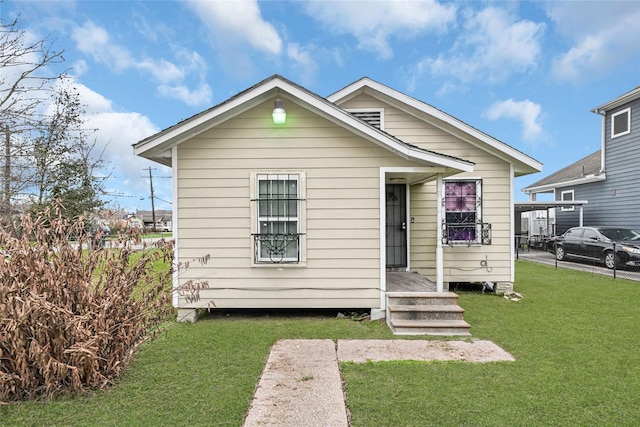 view of front of property with a front lawn