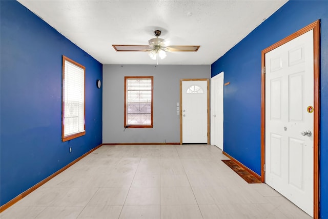 foyer with ceiling fan