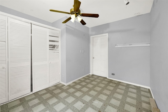 unfurnished bedroom featuring ceiling fan and a closet