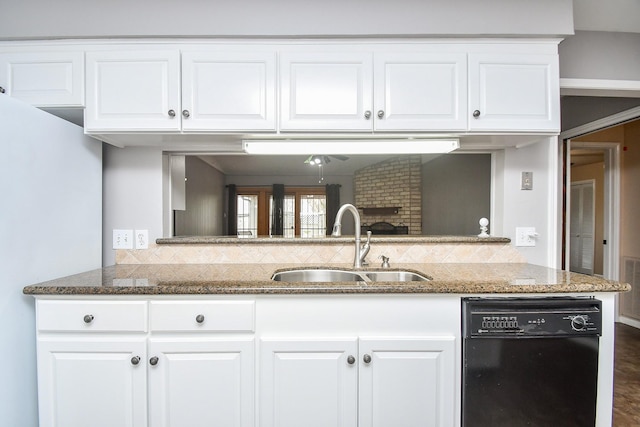 7018 Drowsy Pine Dr, Houston, TX 77092 - kitchen with sink, tasteful backsplash, black dishwasher, dark stone counters, and white cabinets