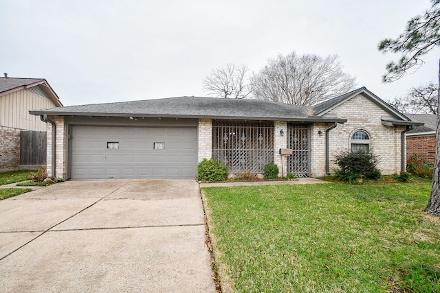 ranch-style home featuring a garage and a front yard