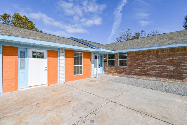 back of house with a patio