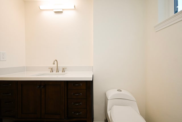 bathroom with vanity and toilet