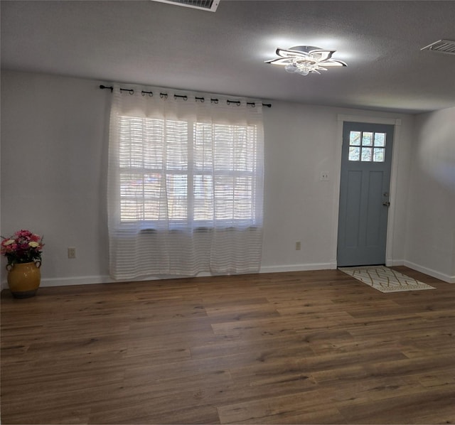 foyer entrance with dark wood-type flooring