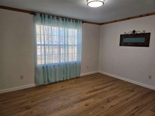 unfurnished room featuring dark hardwood / wood-style flooring