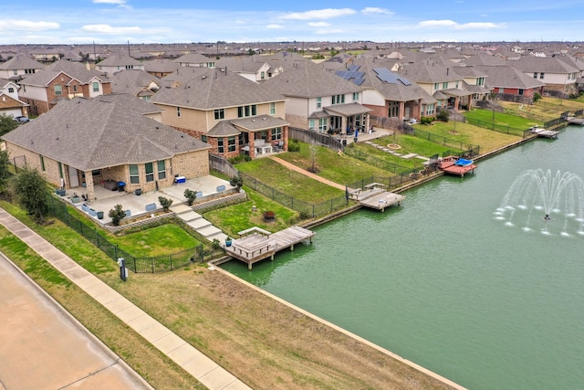 aerial view featuring a water view and a residential view