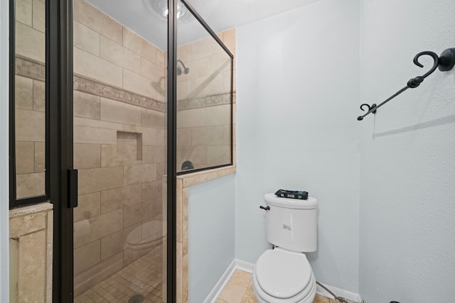 bathroom featuring walk in shower, toilet, and tile patterned flooring