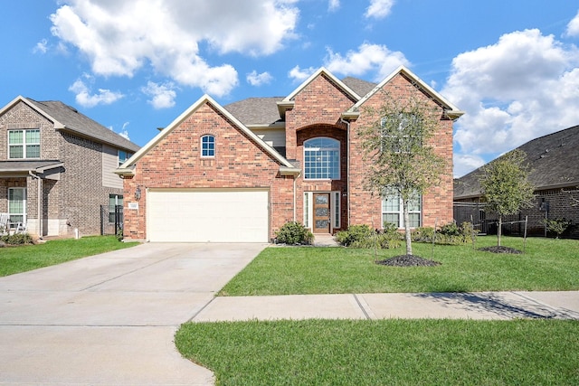 traditional-style house featuring roof with shingles, a front lawn, concrete driveway, a garage, and brick siding