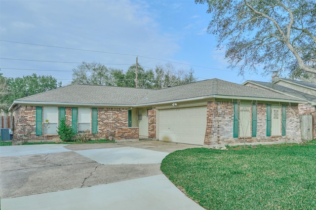 ranch-style house with a garage, a front yard, and central air condition unit