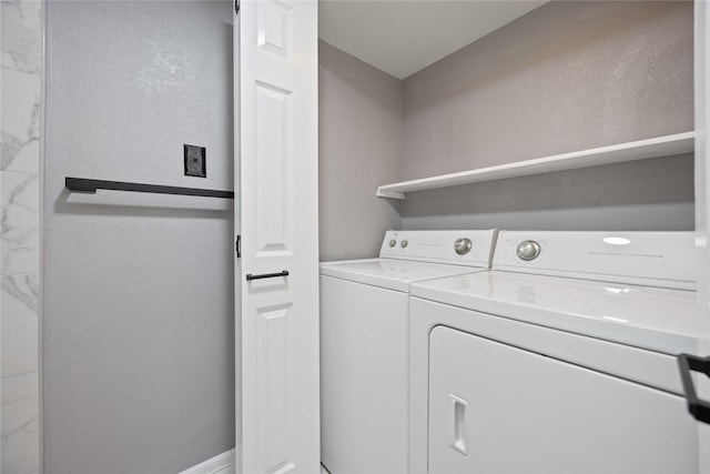 laundry area with washing machine and clothes dryer