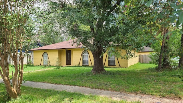 ranch-style house with a front lawn