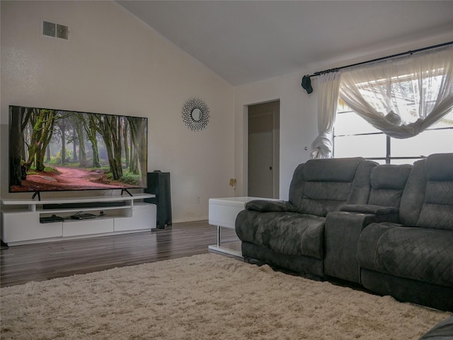 living room with lofted ceiling and dark hardwood / wood-style flooring