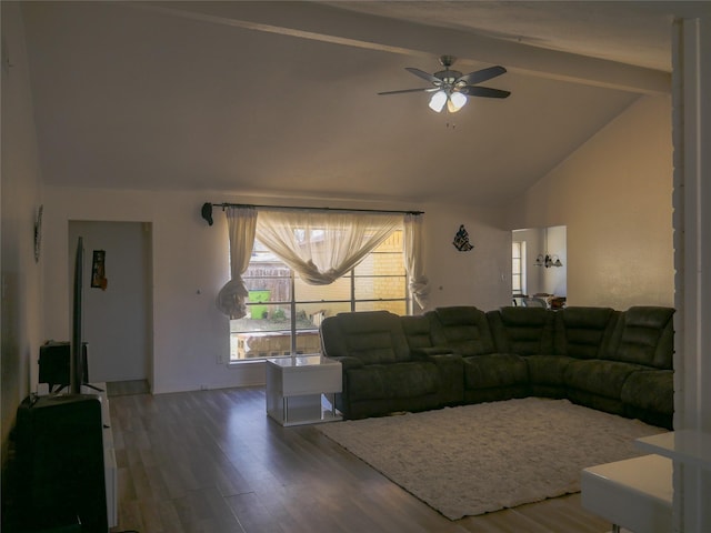 living room with beamed ceiling, ceiling fan, wood-type flooring, and high vaulted ceiling