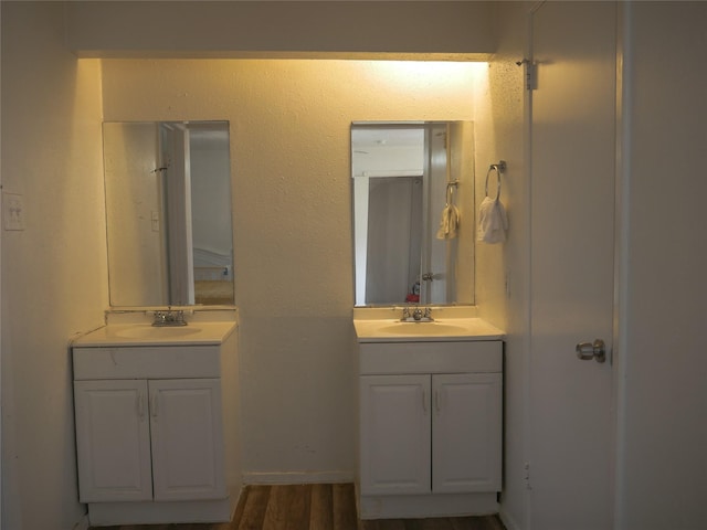 bathroom with vanity and hardwood / wood-style floors