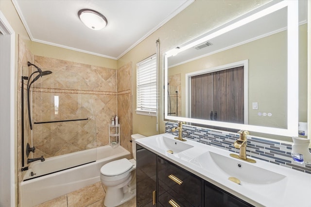 bathroom with toilet, tasteful backsplash, visible vents, and a sink