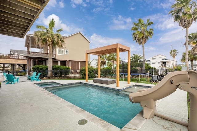 view of pool with a trampoline, a fenced in pool, a patio area, fence private yard, and a water slide