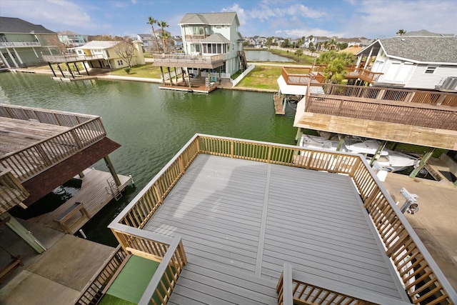 dock area featuring a residential view and a water view