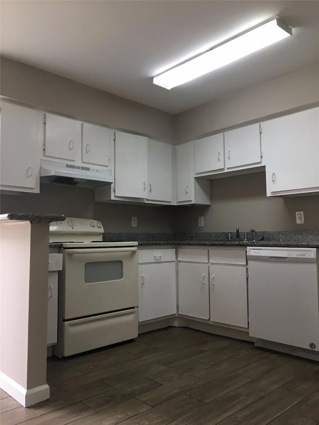 kitchen with white cabinetry, dark wood-type flooring, and white appliances