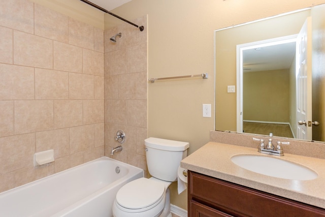 full bathroom with vanity, toilet, and tiled shower / bath combo