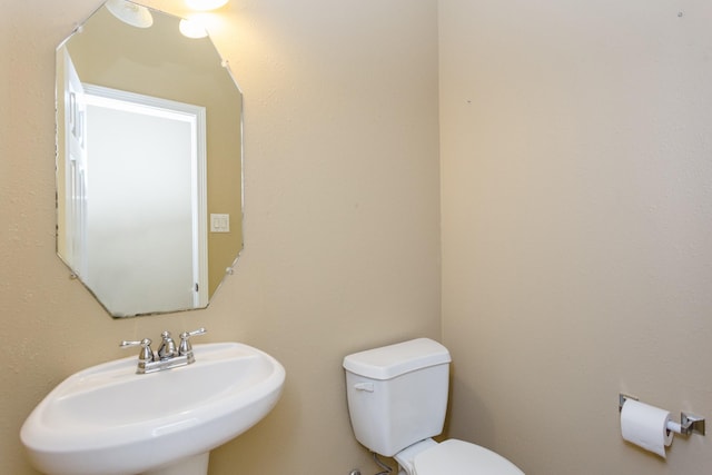 bathroom featuring sink and toilet