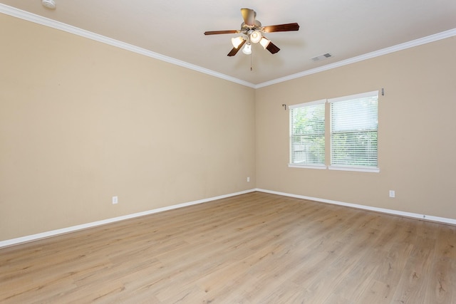 empty room with crown molding, ceiling fan, and light hardwood / wood-style floors