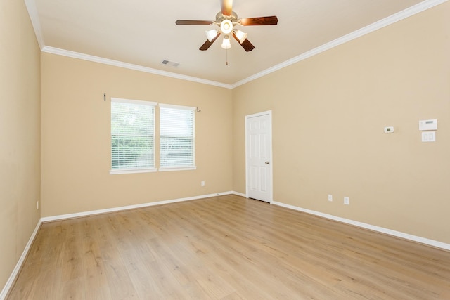 spare room with ceiling fan, ornamental molding, and light wood-type flooring