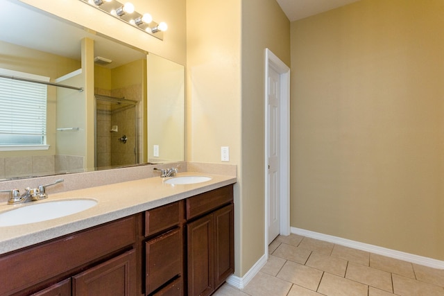 bathroom featuring walk in shower, vanity, and tile patterned flooring