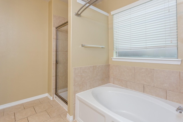 bathroom featuring plus walk in shower and tile patterned floors