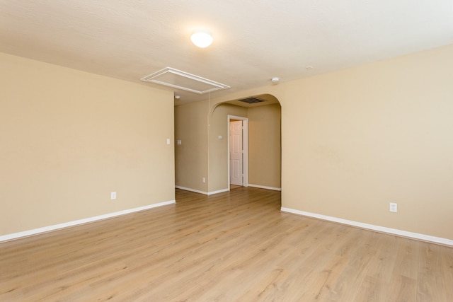 spare room featuring light hardwood / wood-style floors