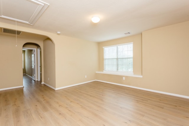 unfurnished room featuring light hardwood / wood-style floors