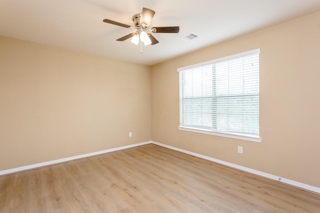 spare room featuring ceiling fan and light hardwood / wood-style floors