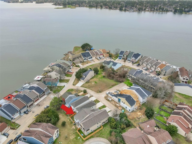 birds eye view of property featuring a water view and a residential view