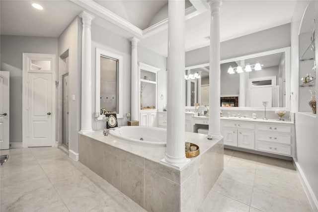 bathroom featuring vanity, independent shower and bath, and ornate columns