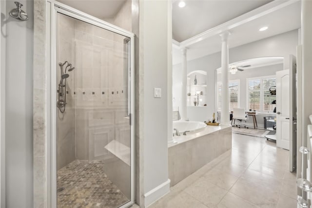 bathroom featuring ceiling fan, tile patterned floors, shower with separate bathtub, and decorative columns