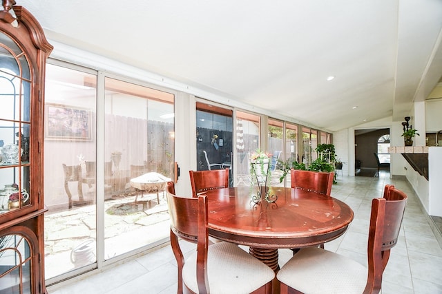 sunroom / solarium featuring lofted ceiling