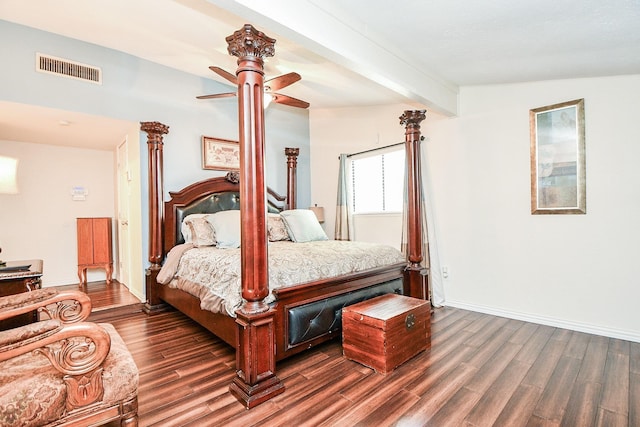 bedroom with ceiling fan, dark wood-type flooring, and beam ceiling