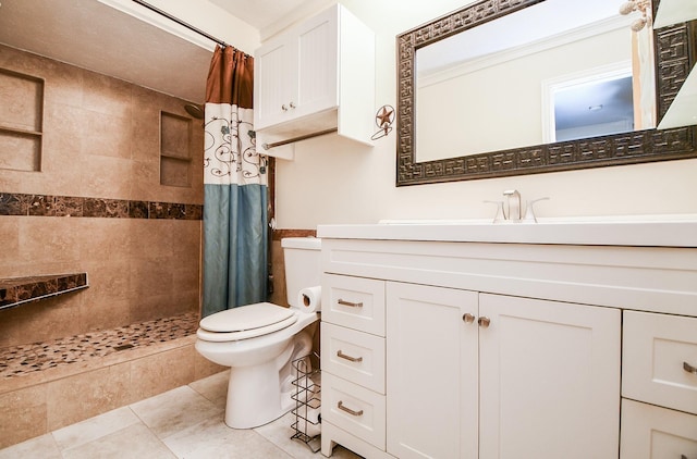 bathroom featuring tile patterned floors, toilet, vanity, and curtained shower