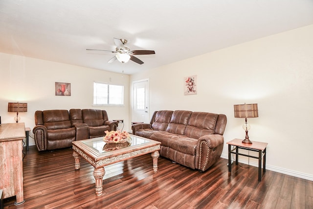 living room with ceiling fan and dark hardwood / wood-style floors