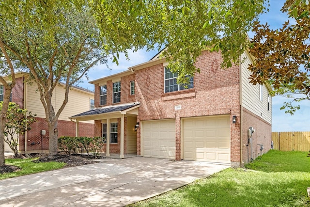 view of property with a garage and a front lawn