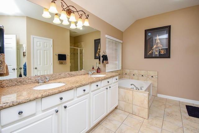 full bath with double vanity, tile patterned floors, a sink, a shower stall, and a bath