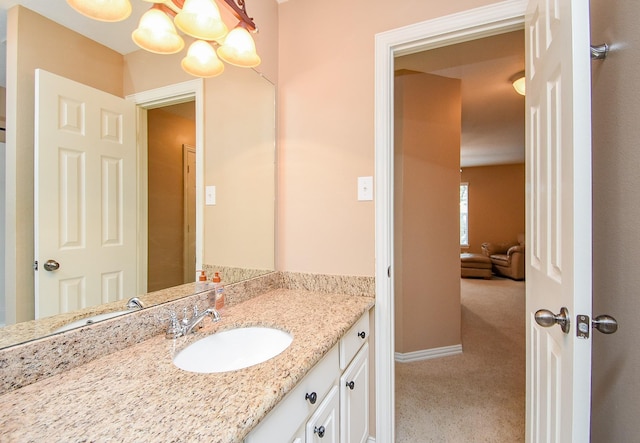 bathroom featuring vanity and baseboards