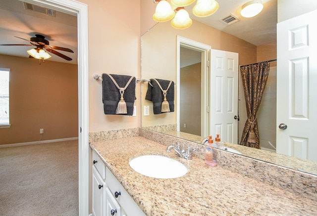 bathroom featuring shower / tub combo, ceiling fan, visible vents, and vanity